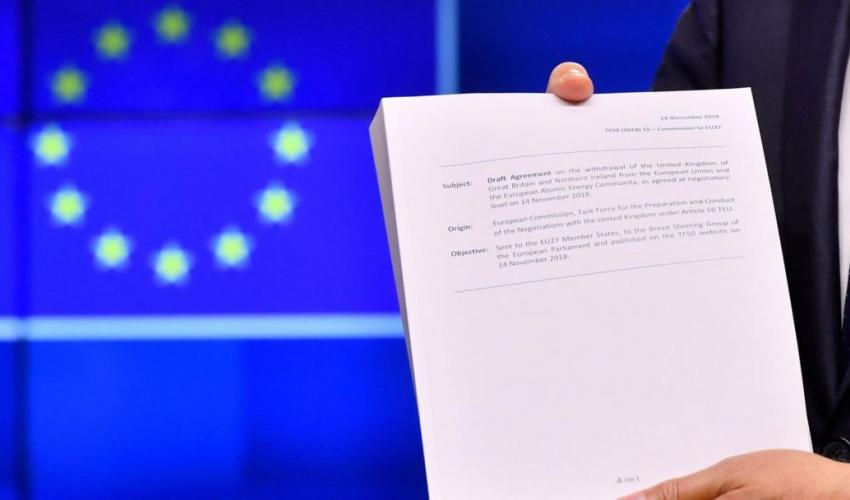 Draft Withdrawal Agreement in front of an EU flag